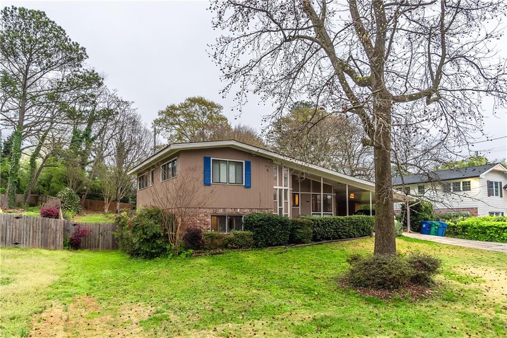 1643 Spruce Valley Drive Decatur, GA 30033 - Photo 1 of 1 a front view of a house with a yard and trees