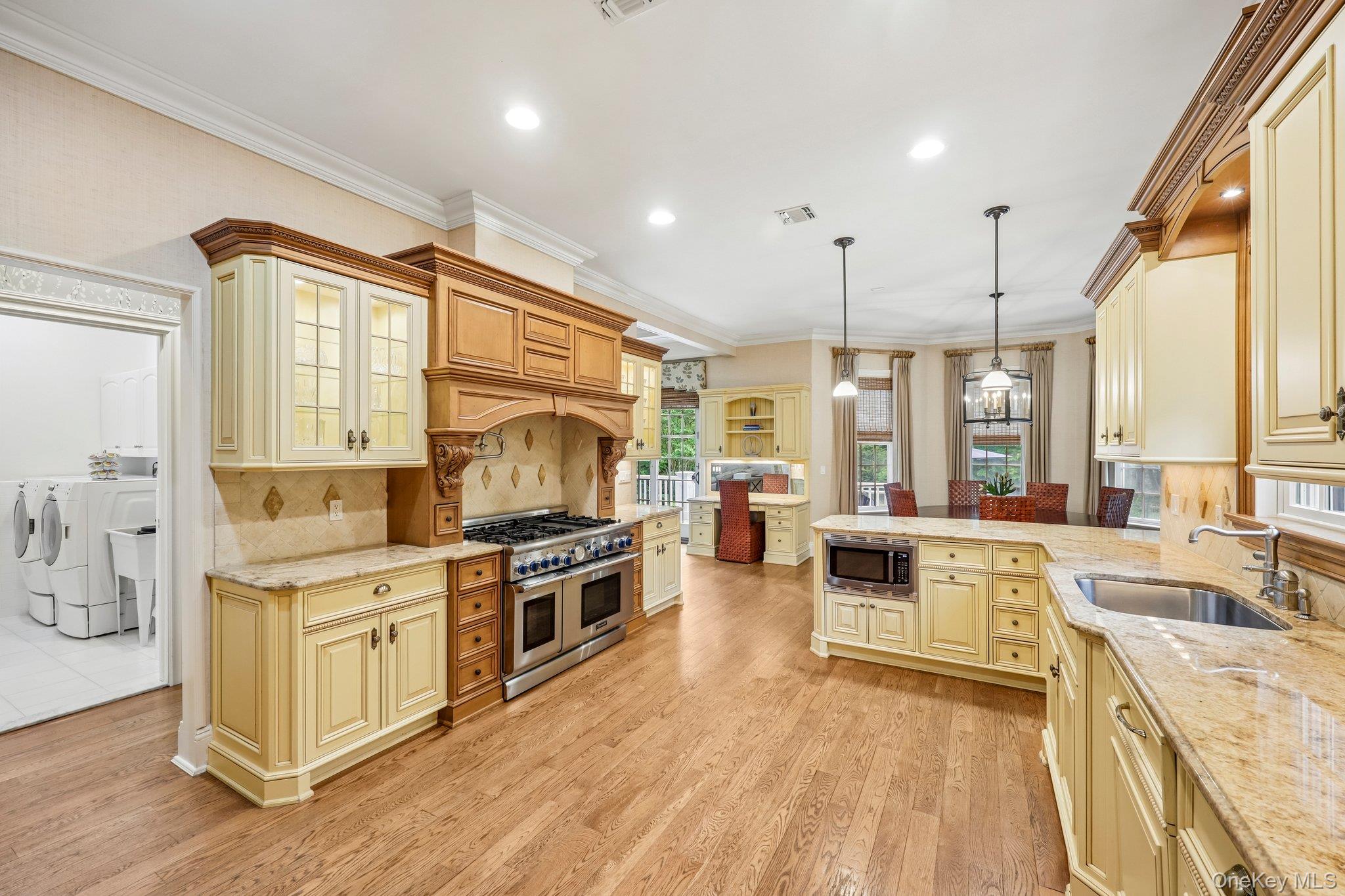 5 Mill Road Lloyd Harbor, NY 11743 - Photo 17 of 49 a large kitchen with stainless steel appliances granite countertop a stove and cabinets