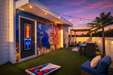 a front view of a house with outdoor seating