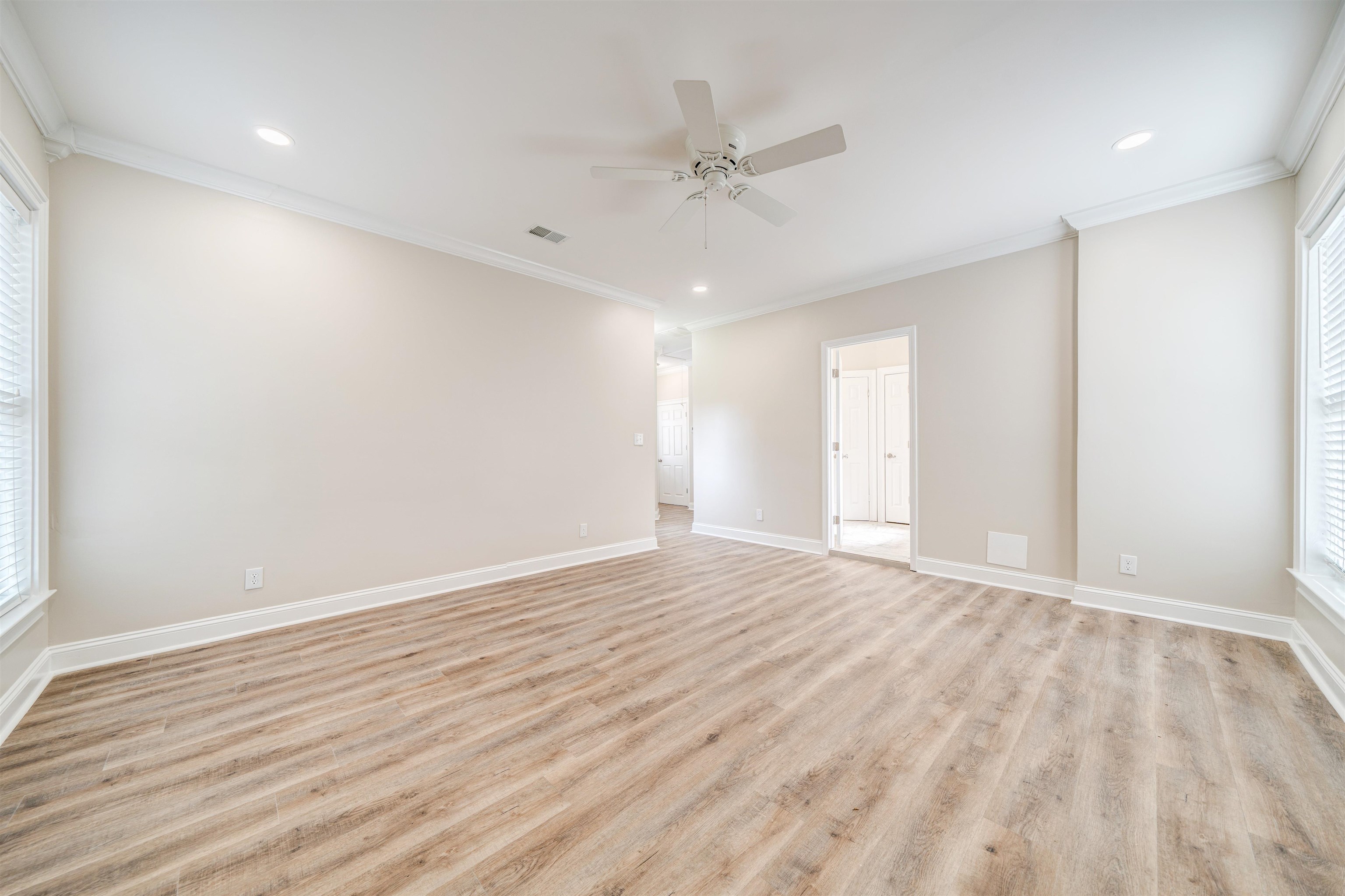 2487 Lynnfield Road Memphis, TN 38119 - Photo 16 of 33 a view of an empty room with wooden floor and a window