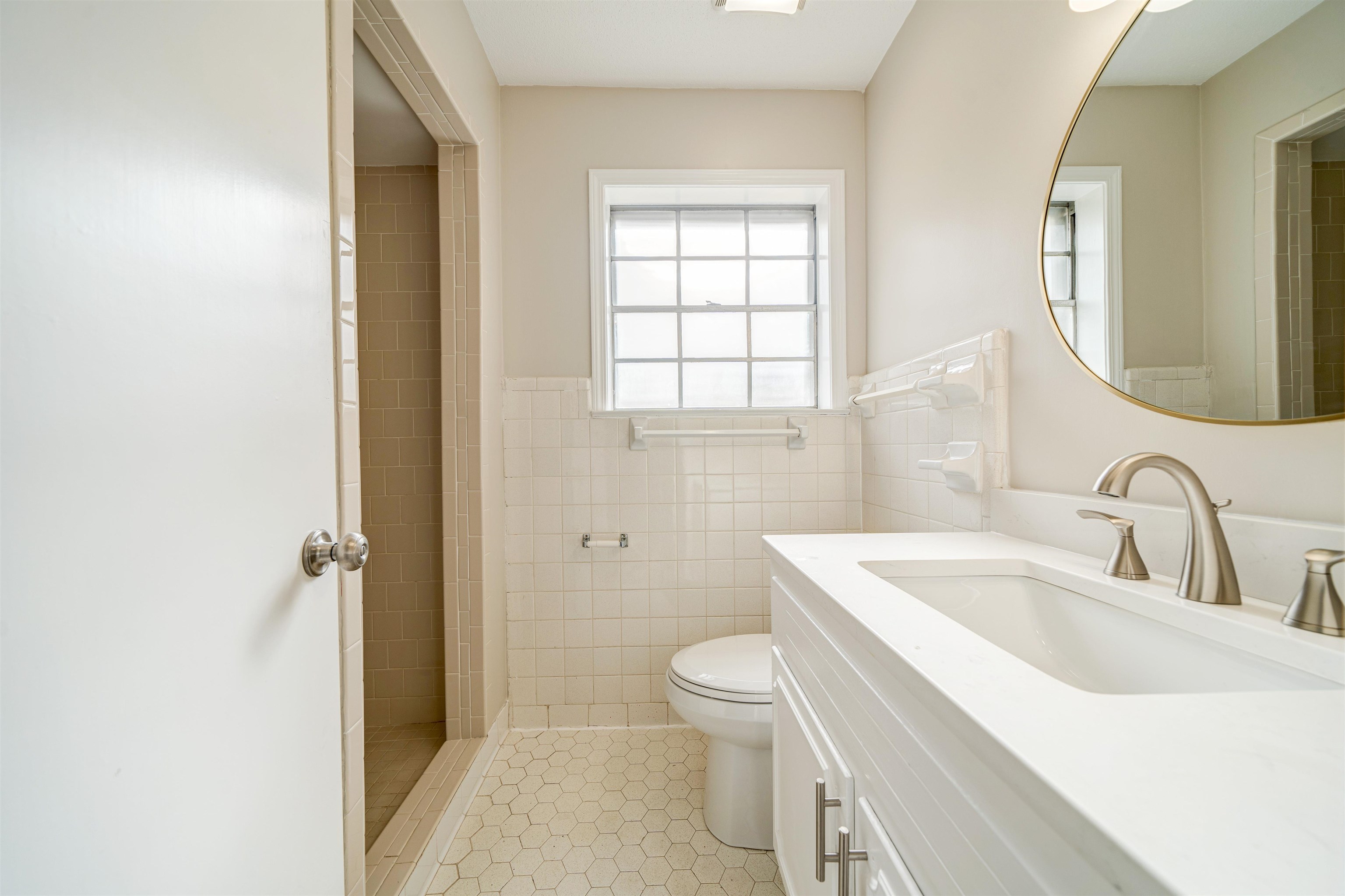 2487 Lynnfield Road Memphis, TN 38119 - Photo 23 of 33 a bathroom with a sink toilet vanity and shower