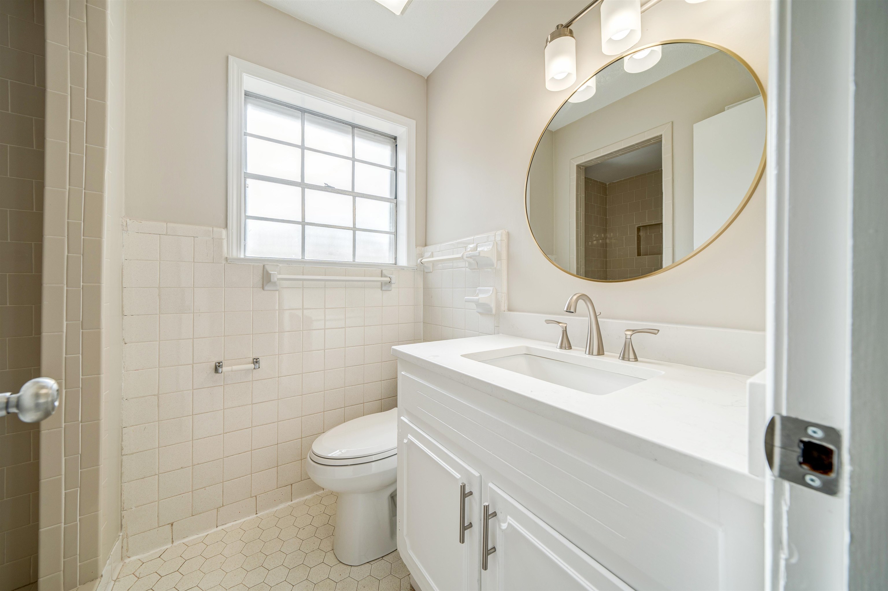 2487 Lynnfield Road Memphis, TN 38119 - Photo 25 of 33 a bathroom with a sink a toilet and a mirror