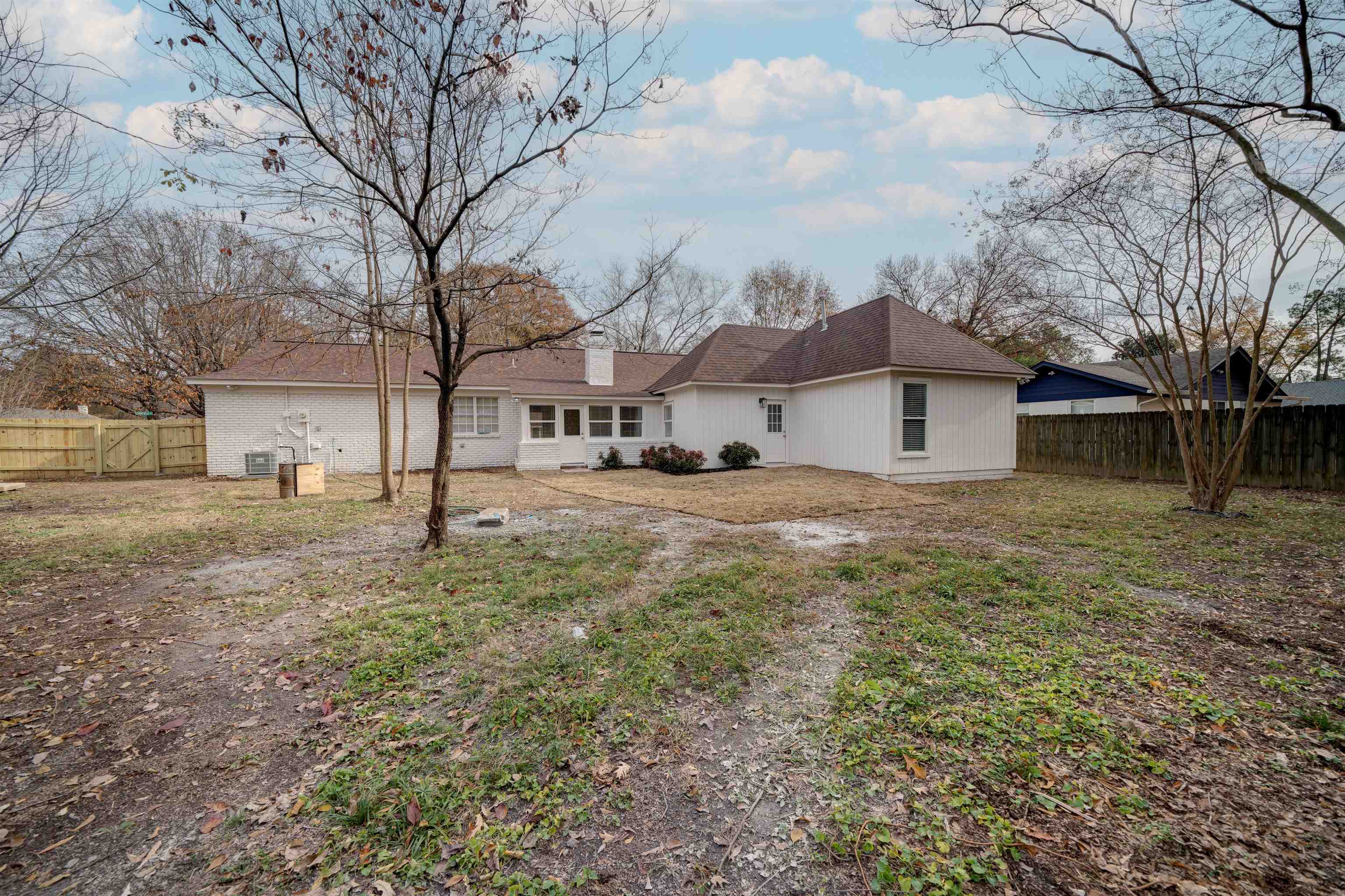 2487 Lynnfield Road Memphis, TN 38119 - Photo 29 of 33 a view of a white house with a yard covered with snow