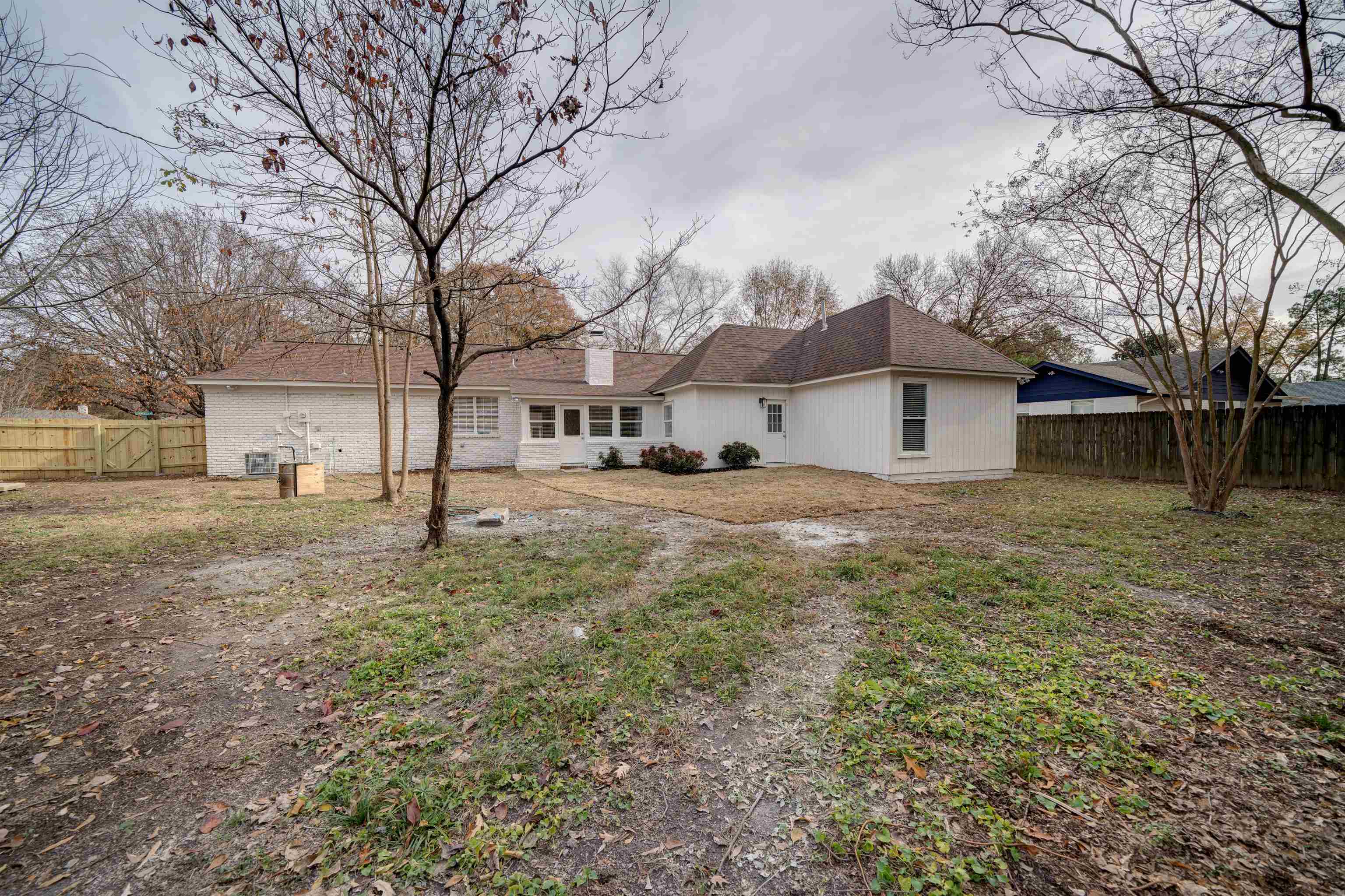 2487 Lynnfield Road Memphis, TN 38119 - Photo 30 of 33 a view of a house with a yard covered in snow