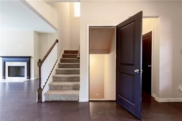 a view of entryway with wooden floor and stairs