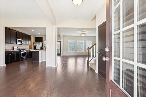 a view of a kitchen with a sink and cabinets