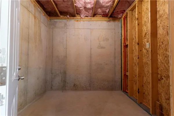 a view of an empty room with wooden walls