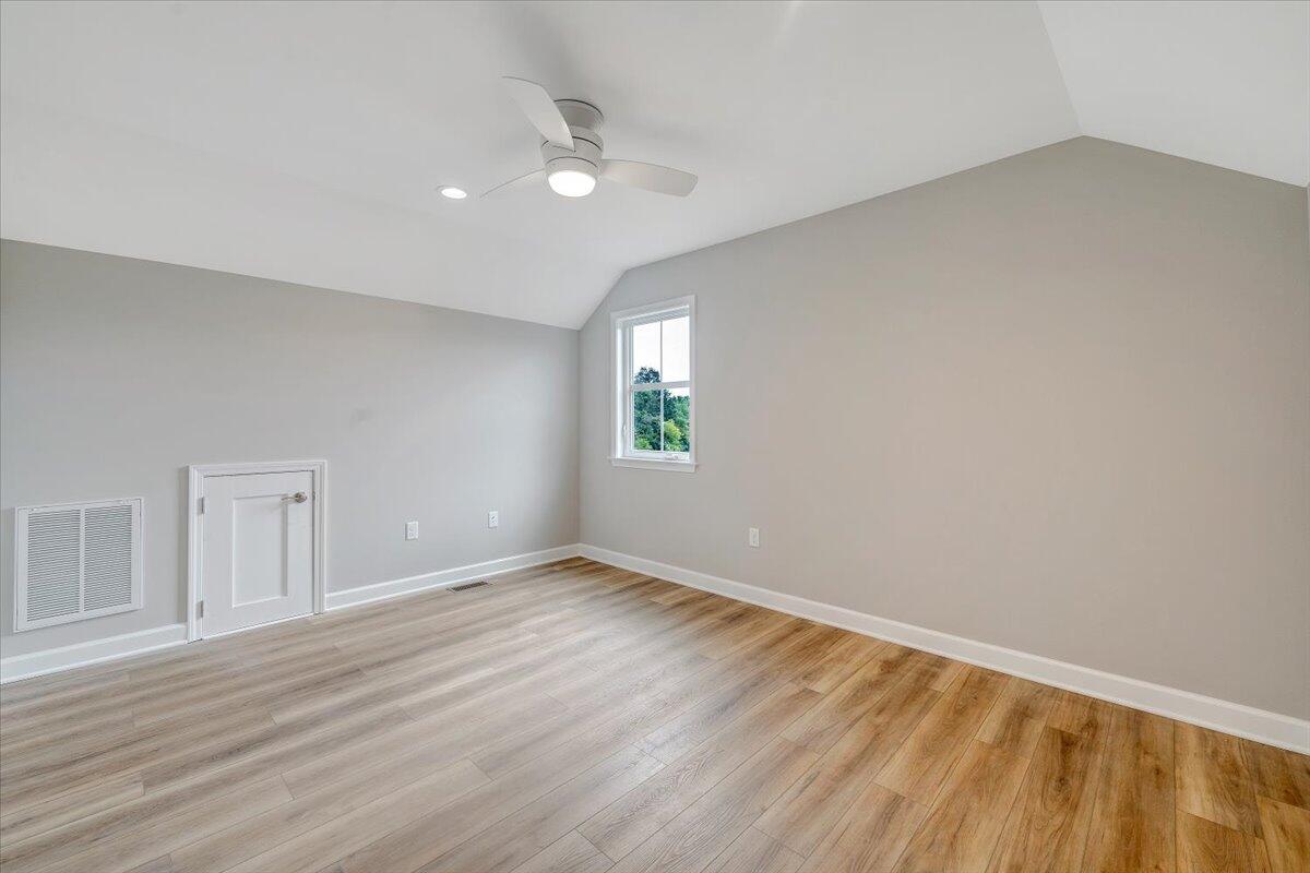 1544 Burnt Chimney Road Wirtz, VA 24184 - Photo 15 of 28 a view of an empty room with wooden floor and a window