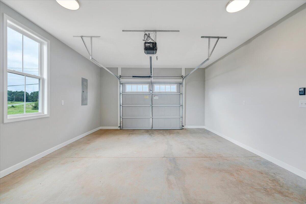 1544 Burnt Chimney Road Wirtz, VA 24184 - Photo 20 of 28 an empty room with windows and ceiling fan