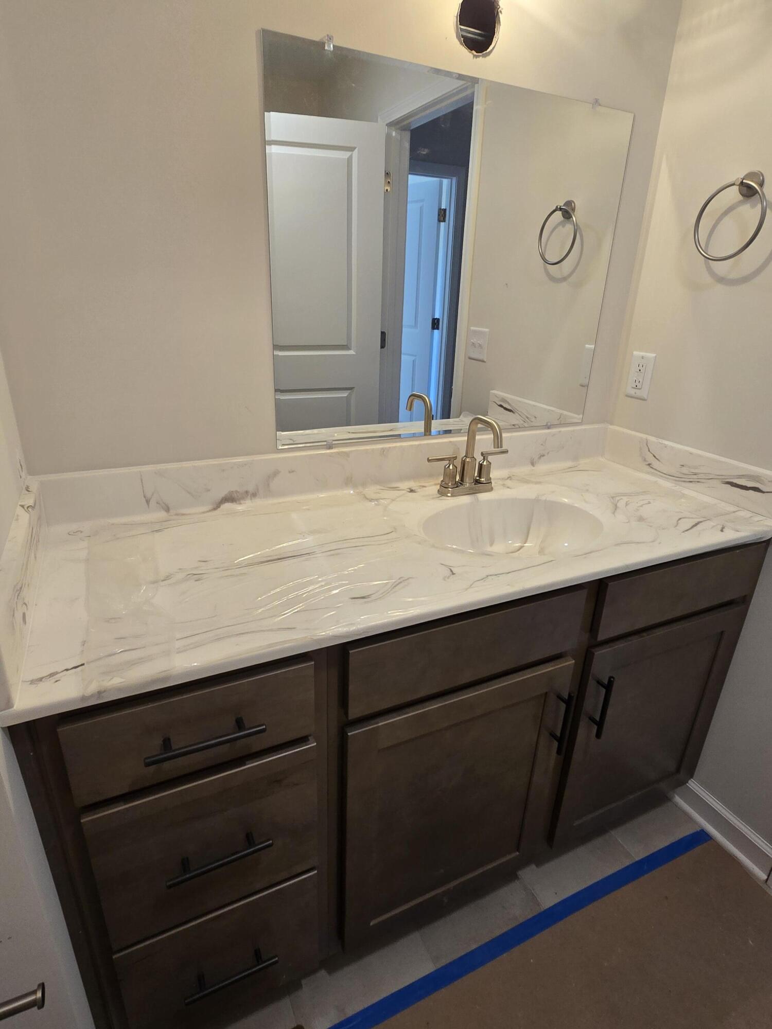 1544 Burnt Chimney Road Wirtz, VA 24184 - Photo 21 of 28 a bathroom with a granite countertop sink and a mirror