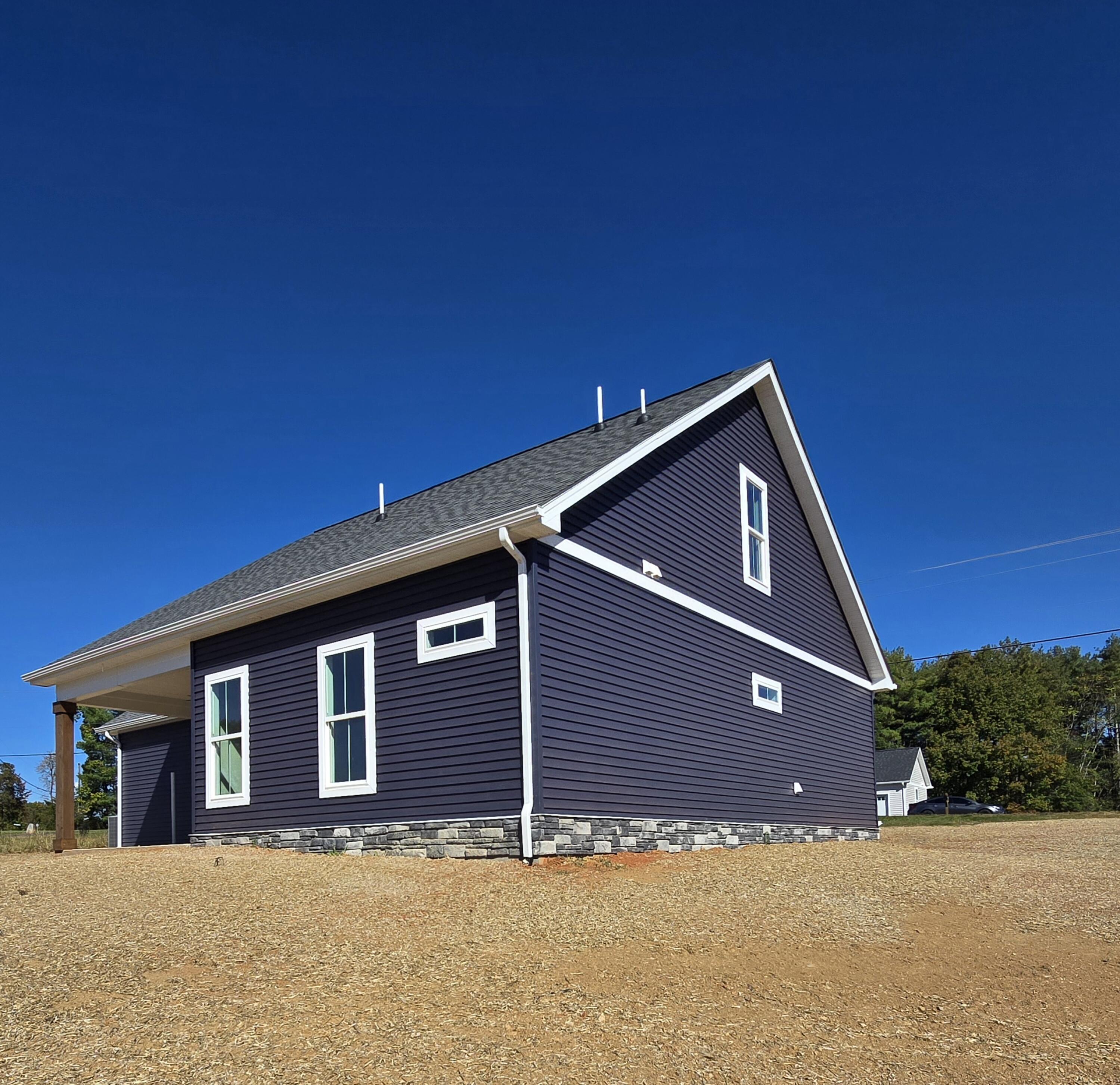 1544 Burnt Chimney Road Wirtz, VA 24184 - Photo 3 of 28 a front view of a house with a yard
