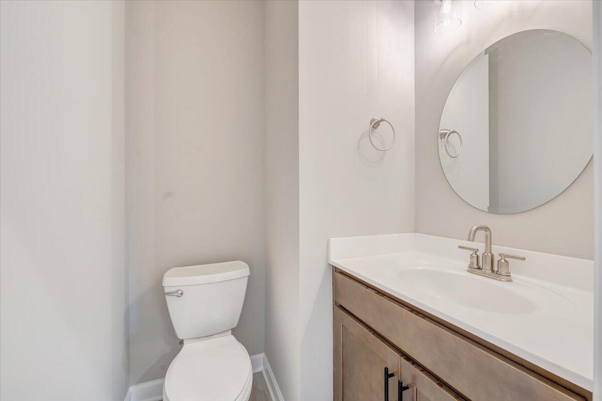 1544 Burnt Chimney Road Wirtz, VA 24184 - Photo 8 of 28 a bathroom with a toilet sink and mirror