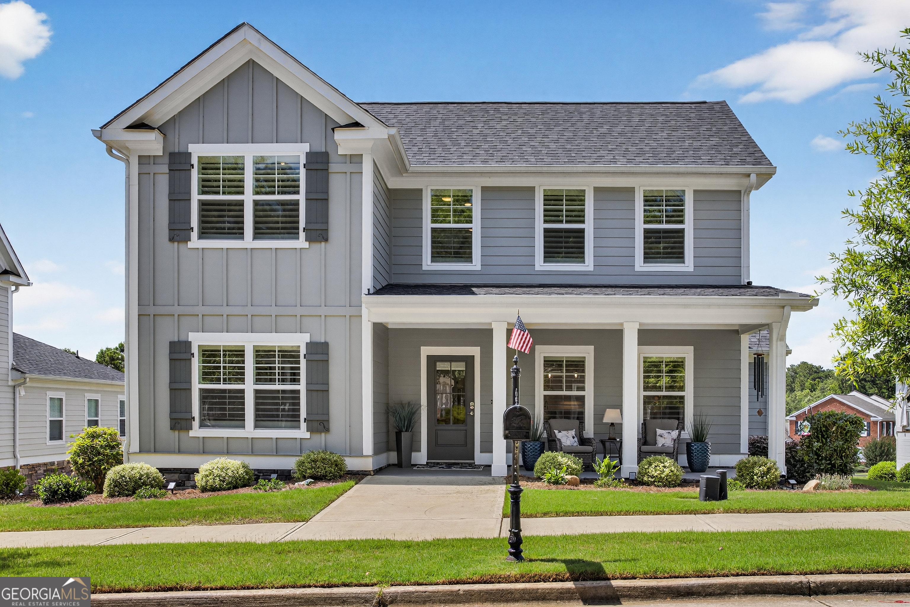 a front view of a house with garden
