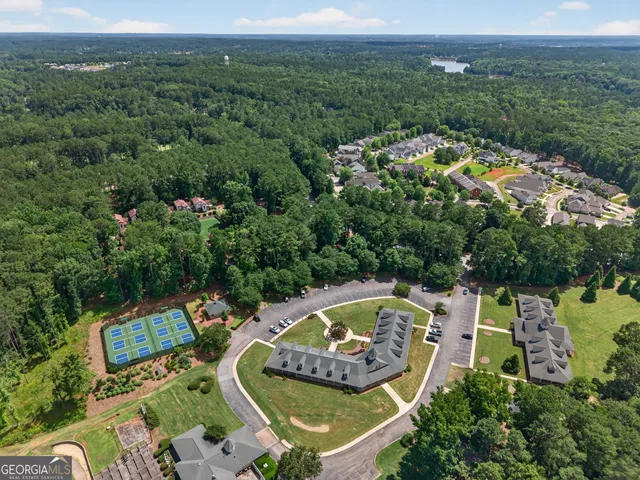 an aerial view of a house with a garden