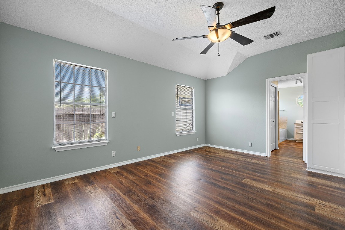 1815 Rusty Nail Loop Round Rock, TX 78681 - Photo 12 of 27 a view of an empty room with window and wooden floor