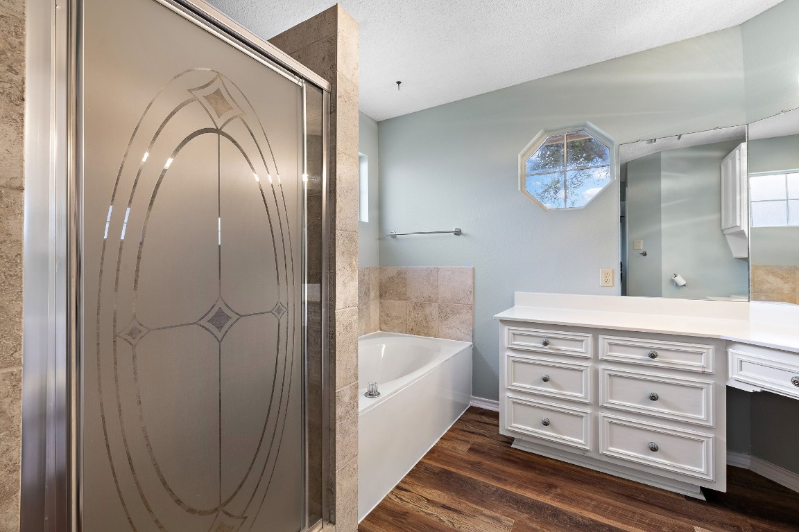 1815 Rusty Nail Loop Round Rock, TX 78681 - Photo 15 of 27 a spacious bathroom with a double vanity sink and a mirror