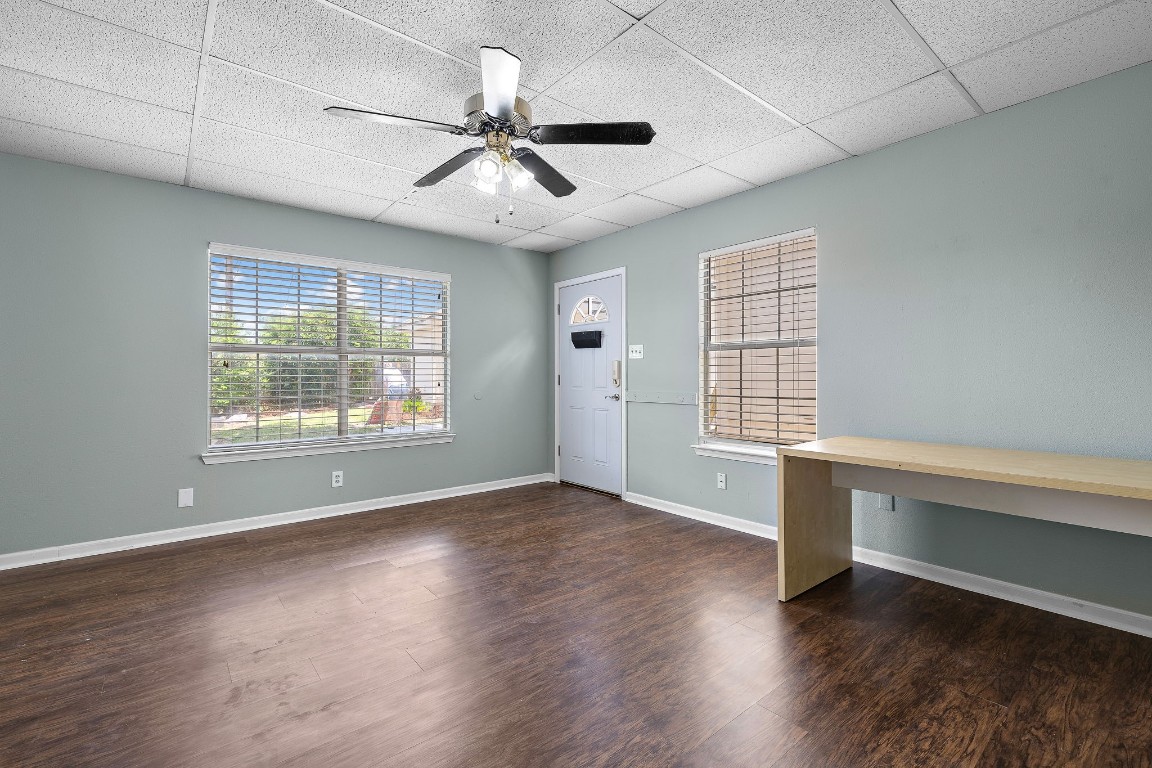 1815 Rusty Nail Loop Round Rock, TX 78681 - Photo 23 of 27 a view of an empty room with wooden floor and a window