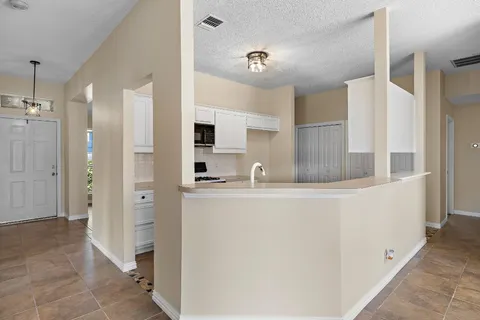 a view of a kitchen with a sink