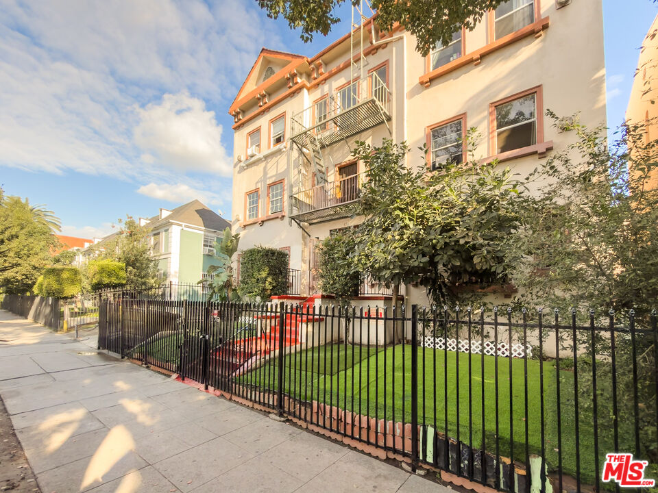 434 South Rampart Boulevard, Unit 301 Los Angeles, CA 90057 - Photo 2 of 16 a view of a brick building from a balcony