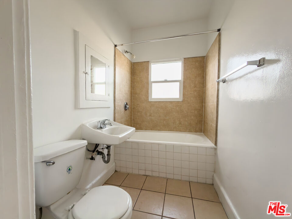 434 South Rampart Boulevard, Unit 301 Los Angeles, CA 90057 - Photo 9 of 16 a bathroom with a sink toilet and shower
