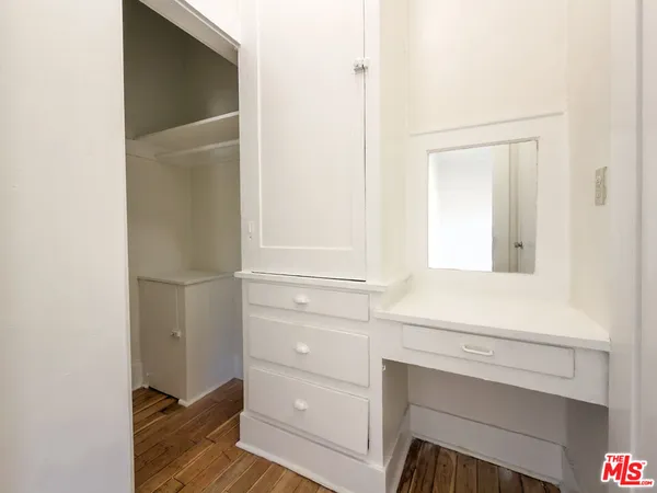 a bathroom with a vanity and mirror