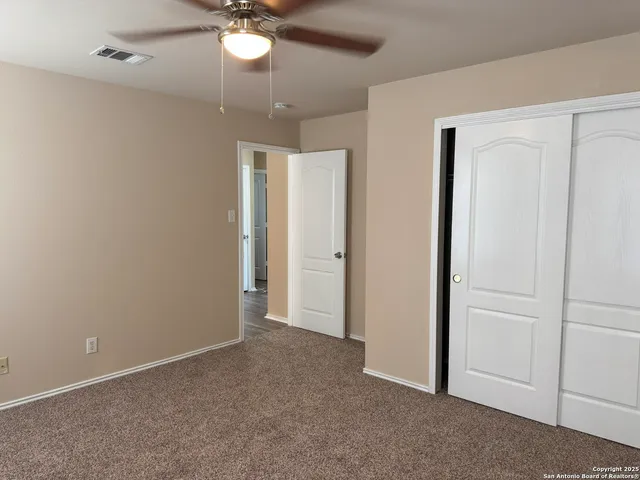 a bathroom with a granite countertop toilet a sink and bathtub