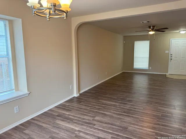 a view of a livingroom with wooden floor
