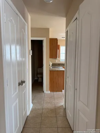 a view of a closet area with living room