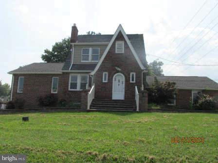 930 Middle River Road Baltimore, MD 21220 - Photo 1 of 2 a front view of a house with a garden