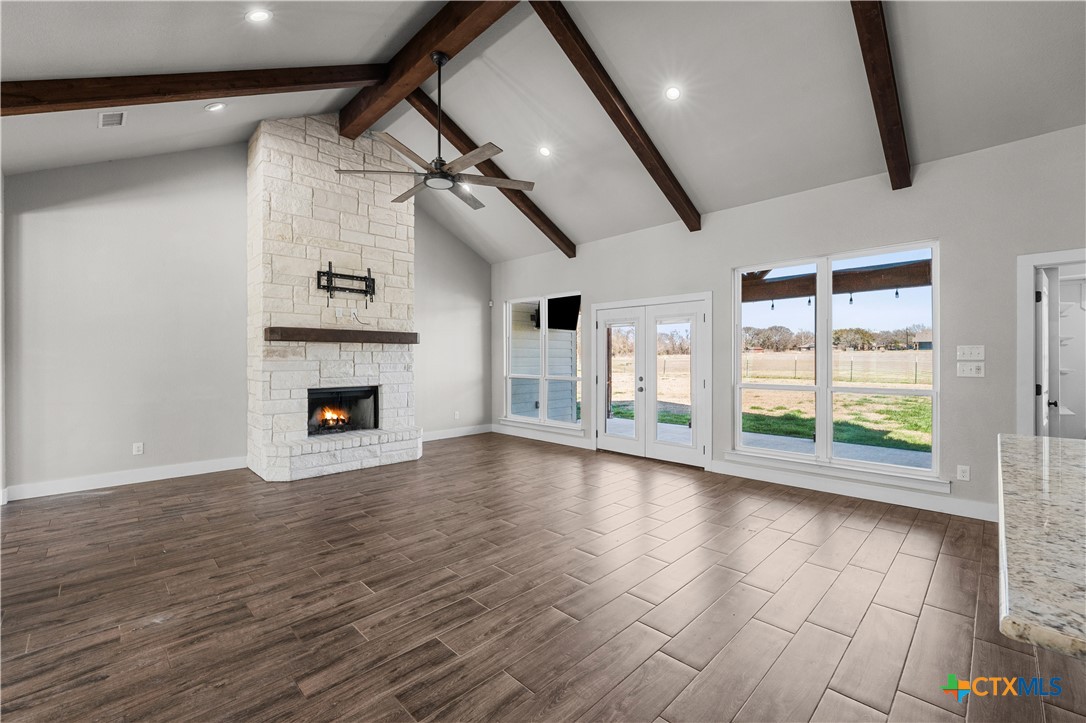 15020 Old Troy Road Troy, TX 76579 - Photo 13 of 48 a view of empty room with wooden floor and fireplace