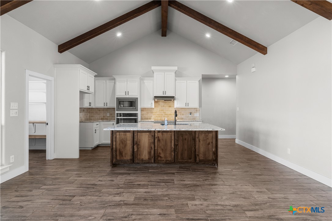 15020 Old Troy Road Troy, TX 76579 - Photo 15 of 48 a view of kitchen with stainless steel appliances cabinets and wooden floor