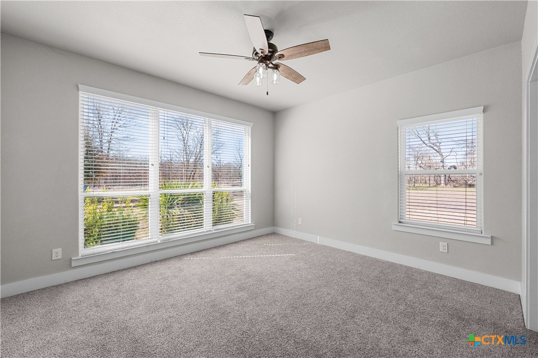 15020 Old Troy Road Troy, TX 76579 - Photo 22 of 48 an empty room with a ceiling fan and window
