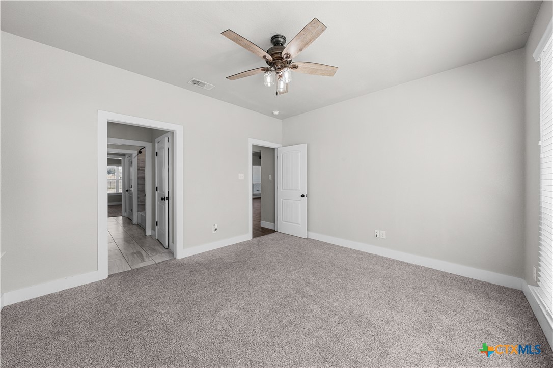 15020 Old Troy Road Troy, TX 76579 - Photo 23 of 48 a view of an empty room and chandelier fan