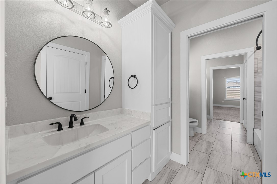 15020 Old Troy Road Troy, TX 76579 - Photo 24 of 48 a bathroom with a sink and mirror