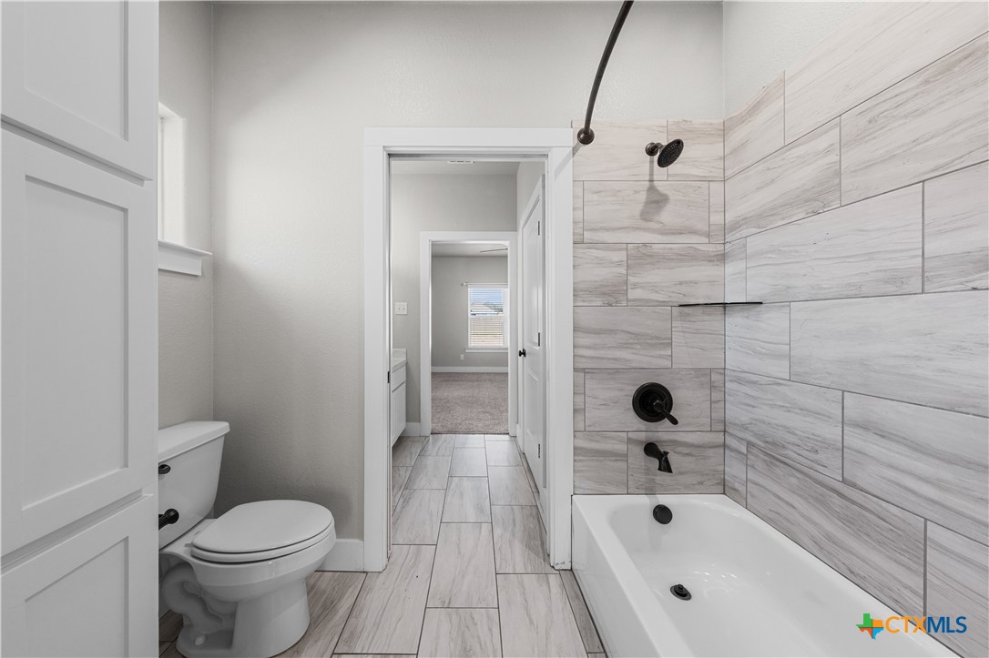 15020 Old Troy Road Troy, TX 76579 - Photo 25 of 48 a bathroom with a sink a toilet and bathtub