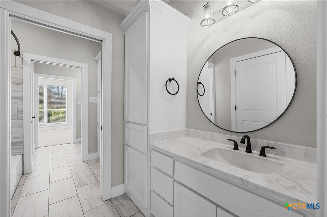 15020 Old Troy Road Troy, TX 76579 - Photo 26 of 48 a bathroom with a sink and a mirror