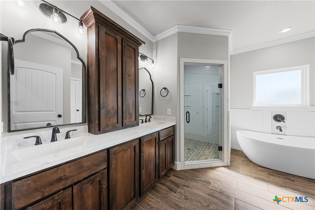 15020 Old Troy Road Troy, TX 76579 - Photo 36 of 48 a spacious bathroom with a double vanity sink mirror and bathtub