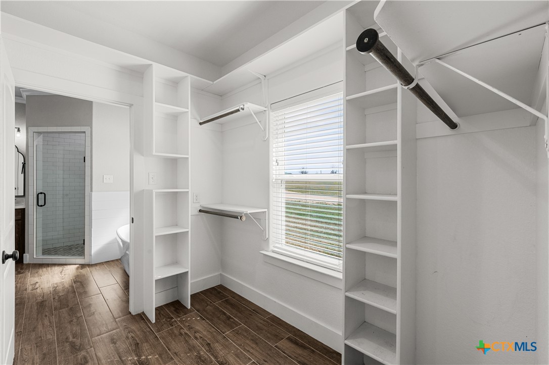 15020 Old Troy Road Troy, TX 76579 - Photo 38 of 48 a view of an empty room with wooden floor and a window