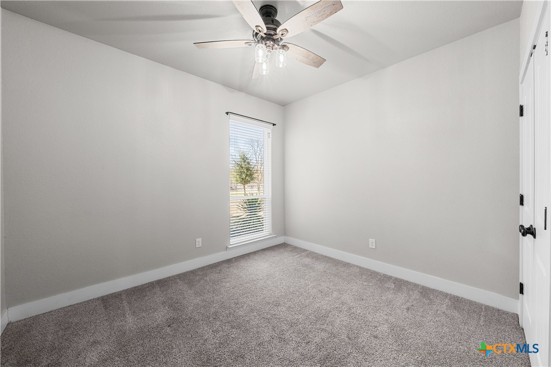15020 Old Troy Road Troy, TX 76579 - Photo 39 of 48 an empty room with windows and fan