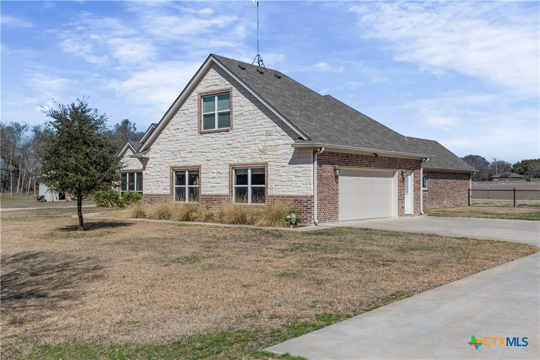 15020 Old Troy Road Troy, TX 76579 - Photo 5 of 48 a front view of a house with a garden