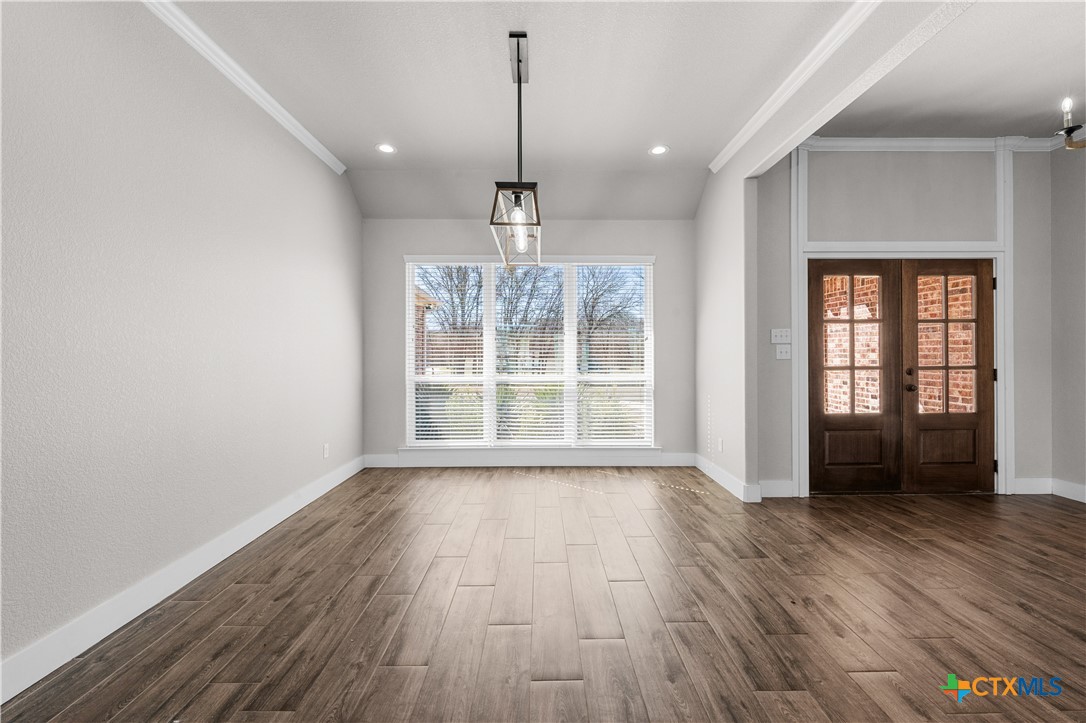 15020 Old Troy Road Troy, TX 76579 - Photo 7 of 48 a view of an empty room with wooden floor and a window