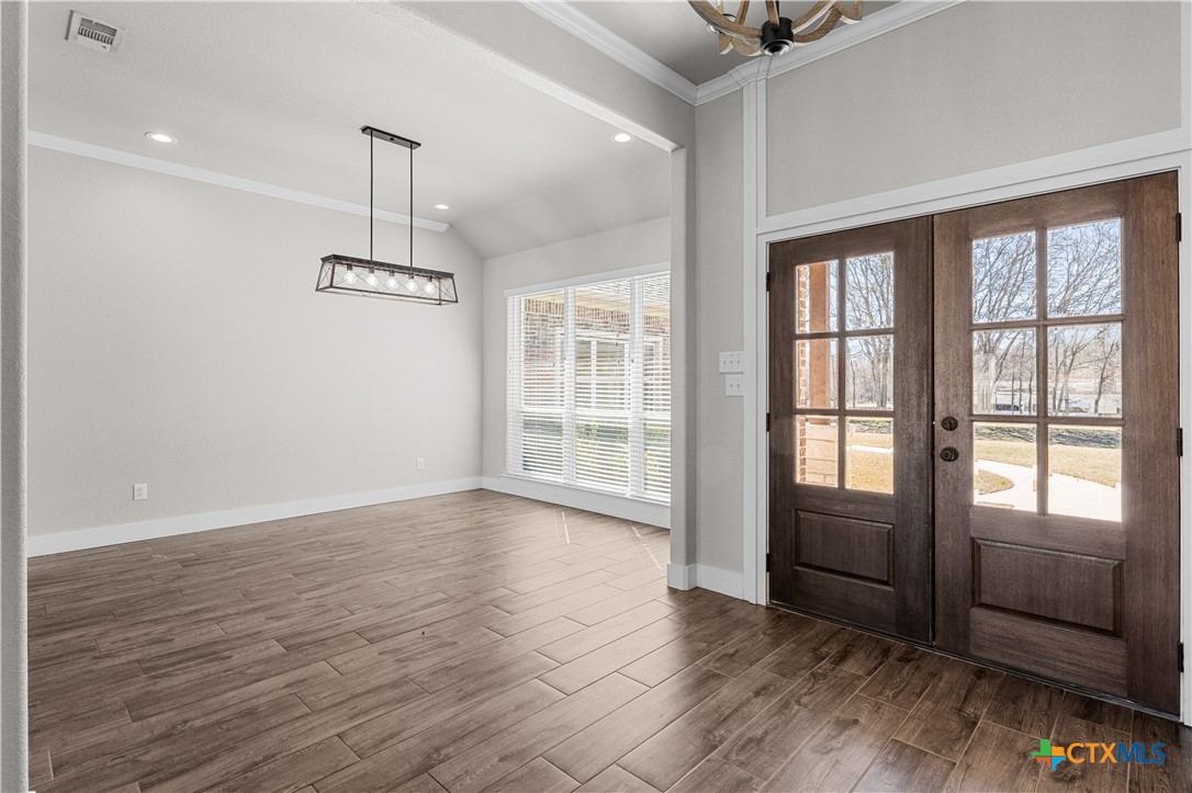 15020 Old Troy Road Troy, TX 76579 - Photo 8 of 48 a view of an empty room with a window and wooden floor
