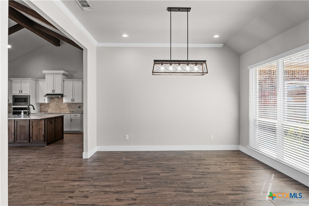 15020 Old Troy Road Troy, TX 76579 - Photo 9 of 48 a view of an empty room with kitchen and window