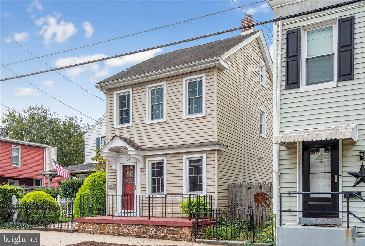 54 Chestnut Street Pottstown, PA 19464 - Photo 1 of 44 a view of a house with a small yard and potted plants