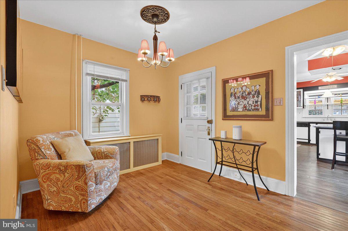 54 Chestnut Street Pottstown, PA 19464 - Photo 11 of 44 a living room with furniture and a chandelier
