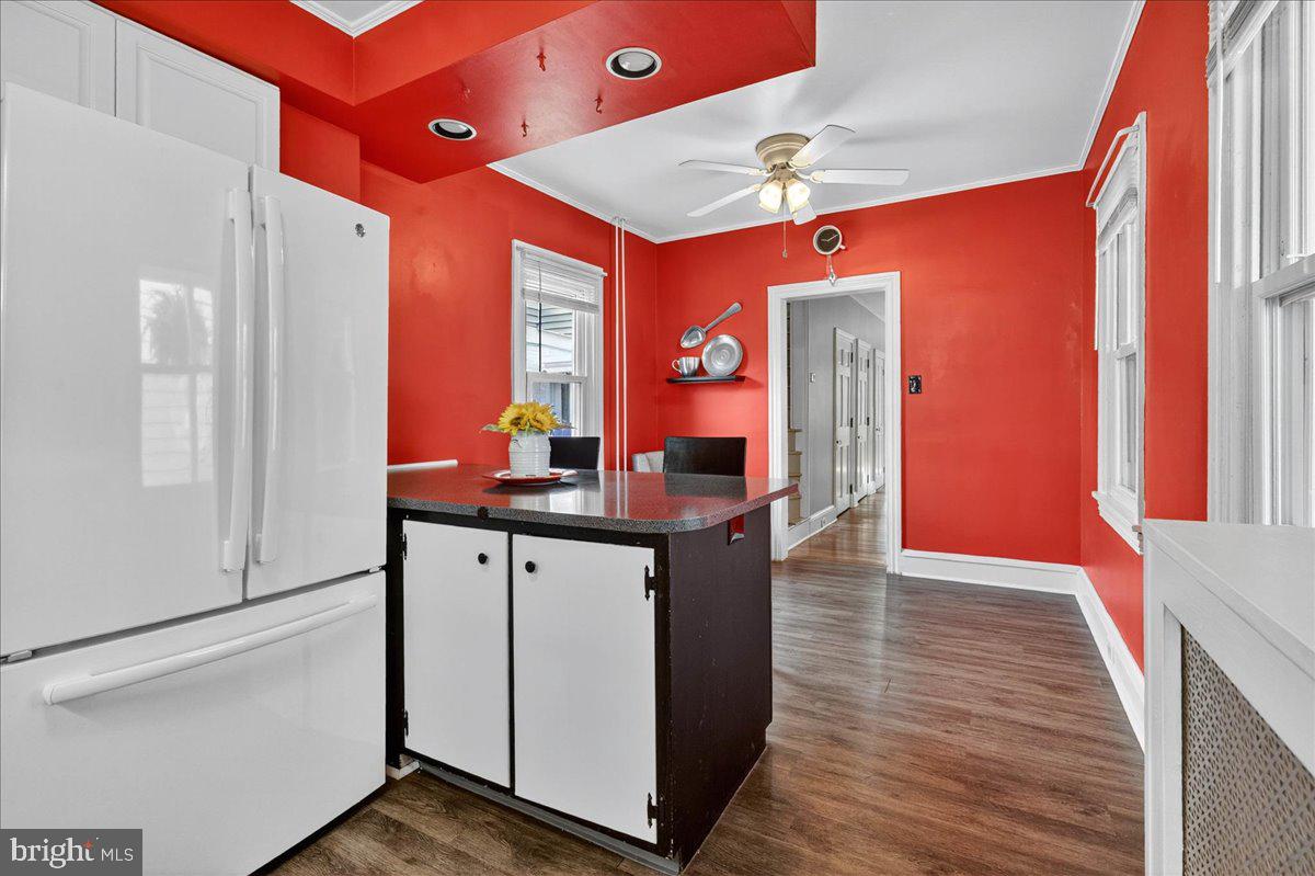 54 Chestnut Street Pottstown, PA 19464 - Photo 16 of 44 a kitchen with stainless steel appliances granite countertop a refrigerator a stove and a sink with wooden floor