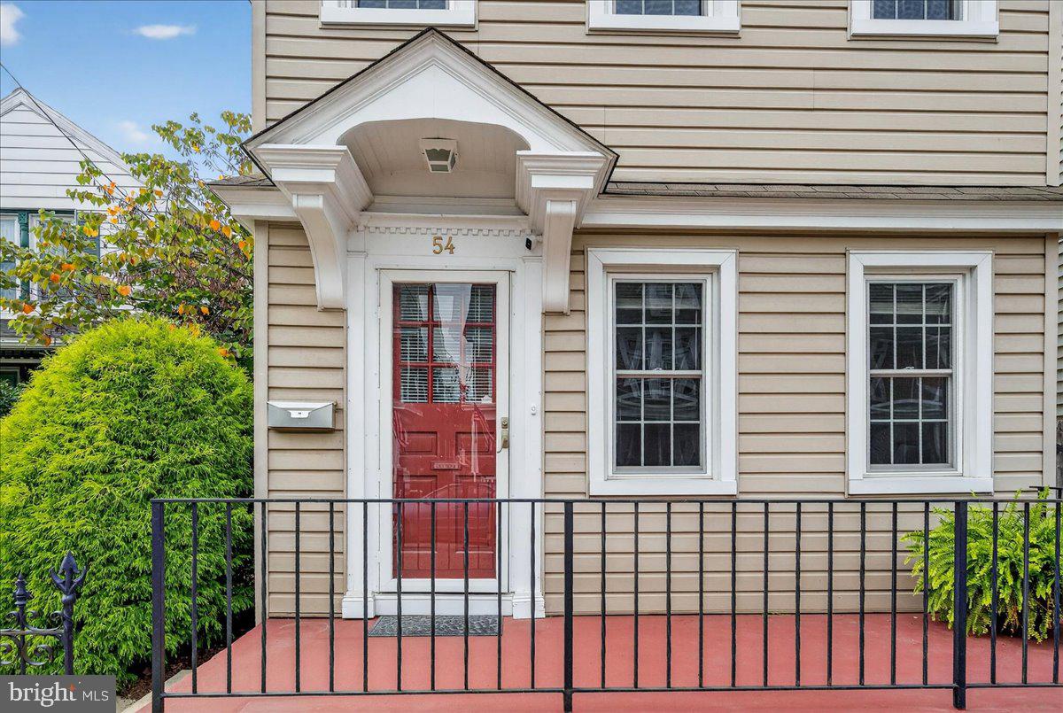 54 Chestnut Street Pottstown, PA 19464 - Photo 3 of 44 a front view of a house with large windows