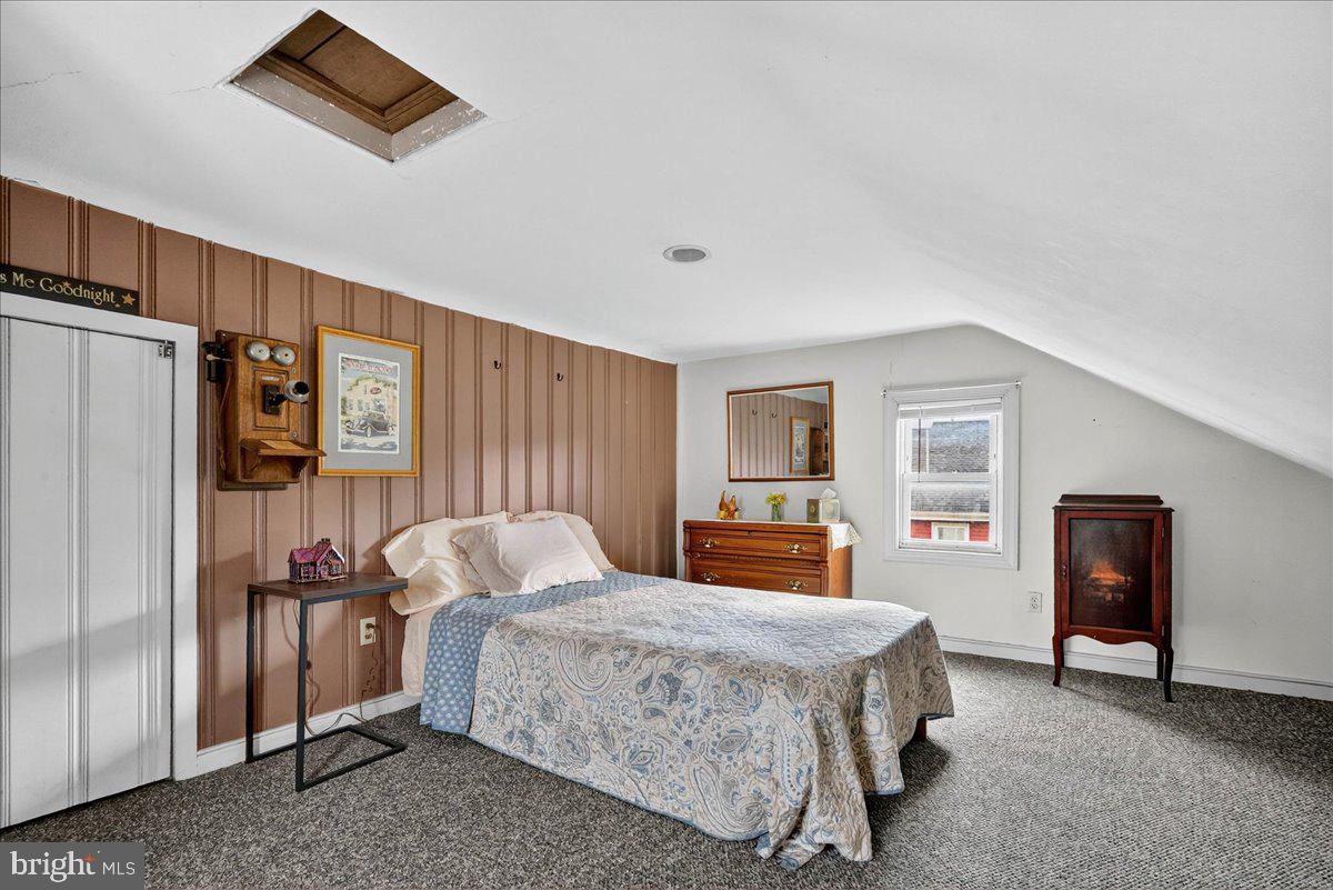 54 Chestnut Street Pottstown, PA 19464 - Photo 32 of 44 a bedroom with a bed and wooden floor