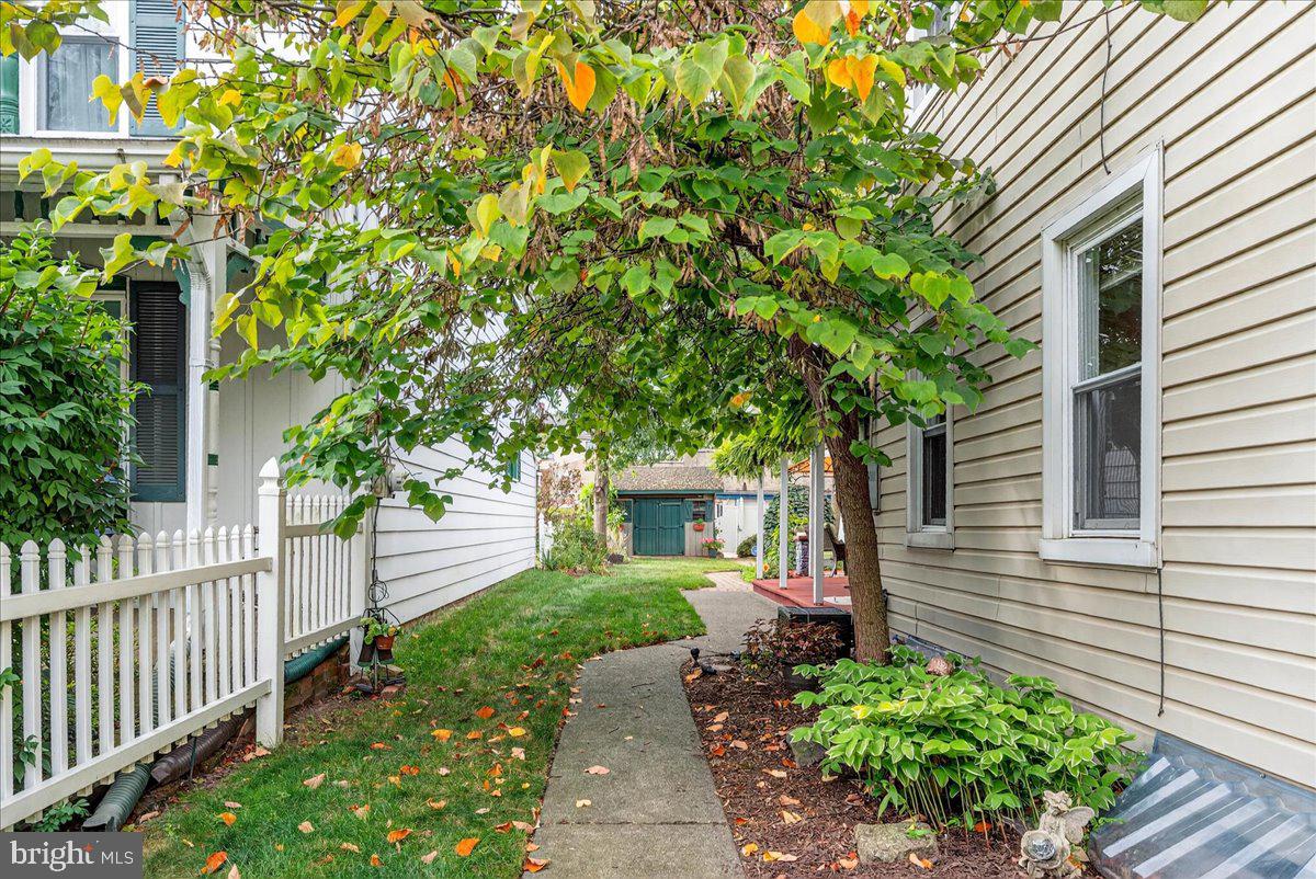54 Chestnut Street Pottstown, PA 19464 - Photo 33 of 44 a front view of a house with a tree