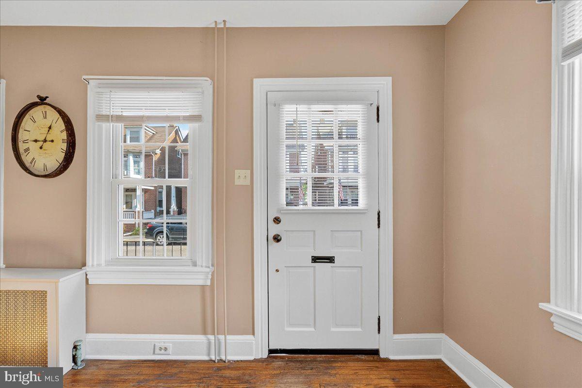 54 Chestnut Street Pottstown, PA 19464 - Photo 6 of 44 a view of a hallway with wooden floor and a window